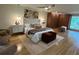Bright bedroom featuring a ceiling fan, ample natural light, and hardwood floors at 4601 Tall Pines Nw Dr, Atlanta, GA 30327