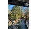 A gorgeous backyard pool surrounded by rock landscaping and mature trees at 4601 Tall Pines Nw Dr, Atlanta, GA 30327