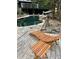 Inviting pool area with stone accents and a deck with lounge seating at 4601 Tall Pines Nw Dr, Atlanta, GA 30327