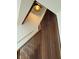 Close-up on a modern staircase with warm wood accents and stylish lighting at 4601 Tall Pines Nw Dr, Atlanta, GA 30327
