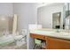 Full bathroom with combined shower and tub, features a vanity with a large mirror at 7847 Dogwood Way, Douglasville, GA 30134