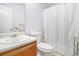 Bathroom featuring a vanity and a shower with white tiled walls and a curtain at 7847 Dogwood Way, Douglasville, GA 30134