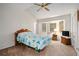 Bright bedroom features a ceiling fan and large windows for plenty of natural light at 7847 Dogwood Way, Douglasville, GA 30134