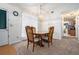 Dining area with a pendant light fixture and a view into an adjacent room at 7847 Dogwood Way, Douglasville, GA 30134