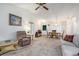 Inviting living room and dining area featuring neutral carpeting and comfortable furnishings at 7847 Dogwood Way, Douglasville, GA 30134
