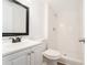Bathroom featuring shower stall, white vanity, and tiled shower at 2174 Rexford Dr, Decatur, GA 30034