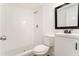 Modern bathroom with tiled walk-in shower, white vanity, and contemporary fixtures, creating a clean and stylish space at 2174 Rexford Dr, Decatur, GA 30034