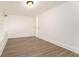 Wood-look floors, white trim and walls plus closet make this bedroom a comfortable space at 2174 Rexford Dr, Decatur, GA 30034