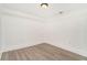Finished bedroom with wood-look floors, recessed lighting and fresh white paint at 2174 Rexford Dr, Decatur, GA 30034