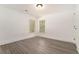 Bright bedroom featuring new wood-look flooring and a fresh coat of bright white paint at 2174 Rexford Dr, Decatur, GA 30034