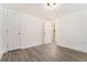 Cozy bedroom with fresh paint, gray-toned flooring, and closet/storage spaces at 2174 Rexford Dr, Decatur, GA 30034