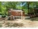 Charming brick home exterior with a well-maintained yard and deck, perfect for outdoor entertaining at 2174 Rexford Dr, Decatur, GA 30034