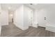 Hallway featuring gray-toned flooring and white walls, baseboards, and doors at 2174 Rexford Dr, Decatur, GA 30034
