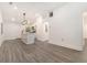 Open kitchen and living space with a white island and modern lighting at 2174 Rexford Dr, Decatur, GA 30034