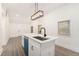 Kitchen featuring a bright island with a modern faucet and sleek, white cabinets, creating a clean aesthetic at 2174 Rexford Dr, Decatur, GA 30034