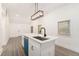 Stylish kitchen island with a modern sink, sleek faucet, and contemporary lighting fixture above at 2174 Rexford Dr, Decatur, GA 30034