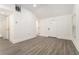 Bright living room with new grey flooring, white walls, vaulted ceiling, and a front door at 2174 Rexford Dr, Decatur, GA 30034