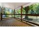Inviting covered porch with wood flooring and modern railing, perfect for relaxing outdoors at 2174 Rexford Dr, Decatur, GA 30034