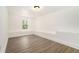 Finished room features new gray-toned flooring and fresh coat of bright white paint at 2174 Rexford Dr, Decatur, GA 30034