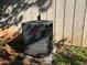 Exterior shot of the home's Goodman AC unit, set against the siding with surrounding greenery at 3230 Plymouth Rock Dr, Douglasville, GA 30135