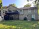 View of the home's backyard showing deck, siding and some landscaping at 3230 Plymouth Rock Dr, Douglasville, GA 30135
