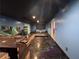 Basement with a bar, dark ceiling, light blue walls, and unique flooring at 3230 Plymouth Rock Dr, Douglasville, GA 30135