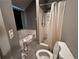 Bathroom featuring a bathtub, tiled shower, toilet, and neutral color palette at 3230 Plymouth Rock Dr, Douglasville, GA 30135