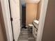 Bathroom featuring a vanity with storage, toilet, and wood-look tile floors at 3230 Plymouth Rock Dr, Douglasville, GA 30135