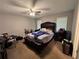 Bedroom showcasing a bed with a tufted headboard, neutral walls, and carpet flooring at 3230 Plymouth Rock Dr, Douglasville, GA 30135