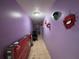 Hallway with superhero-themed decor and tile flooring at 3230 Plymouth Rock Dr, Douglasville, GA 30135