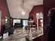 A living room with vaulted ceilings, wood flooring, and an entertainment center at 3230 Plymouth Rock Dr, Douglasville, GA 30135