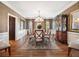 Formal dining room featuring a chandelier, hardwood floors, and ample seating at 3495 Mill Bridge Dr, Marietta, GA 30062