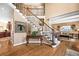 Inviting foyer with a decorative staircase, hardwood floors, and stylish accents at 3495 Mill Bridge Dr, Marietta, GA 30062
