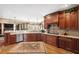 Modern kitchen with custom cabinets, granite countertops, a stainless steel dishwasher, and hardwood flooring at 3495 Mill Bridge Dr, Marietta, GA 30062