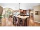 Gourmet kitchen featuring a large island with bar seating, custom cabinetry, and hardwood floors at 3495 Mill Bridge Dr, Marietta, GA 30062