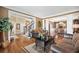 Open-concept living room with hardwood floors, staircase, and elegant furnishings at 3495 Mill Bridge Dr, Marietta, GA 30062