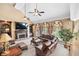 Spacious living room with a stone fireplace, vaulted ceilings, and large windows providing natural light at 3495 Mill Bridge Dr, Marietta, GA 30062