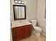 Bathroom featuring a vanity with wood cabinets, white countertop and tile floors at 121 Brittany Ct, Duluth, GA 30096