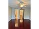 Bedroom showcasing hardwood floors, a ceiling fan, and an en-suite bathroom with marble accents at 121 Brittany Ct, Duluth, GA 30096