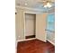 Bedroom with a closet, hardwood flooring and neutral walls at 121 Brittany Ct, Duluth, GA 30096