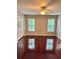 Bedroom with neutral walls, two windows and ceiling fan at 121 Brittany Ct, Duluth, GA 30096