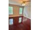 Bedroom with hardwood floors, neutral paint, and natural light at 121 Brittany Ct, Duluth, GA 30096