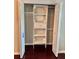 Organized closet with shelving and a hanging rod, providing ample storage space at 121 Brittany Ct, Duluth, GA 30096