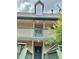 Two-story condo showcasing a balcony and neutral paint at 121 Brittany Ct, Duluth, GA 30096