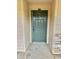 Green front door with sandstone accents at 121 Brittany Ct, Duluth, GA 30096