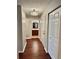 Hallway featuring hardwood floors with a view to the bathroom at 121 Brittany Ct, Duluth, GA 30096