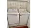Laundry room featuring a modern Samsung dryer and an Amana washing machine for convenience at 121 Brittany Ct, Duluth, GA 30096