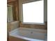 Bathroom showing a large tub with tile surround at 1504 Gallup Dr, Stockbridge, GA 30281