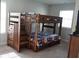 bedroom with a wooden bunk bed set with stairs at 1504 Gallup Dr, Stockbridge, GA 30281