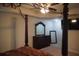 Bedroom featuring a four-poster bed, dresser, and ceiling fan at 1504 Gallup Dr, Stockbridge, GA 30281